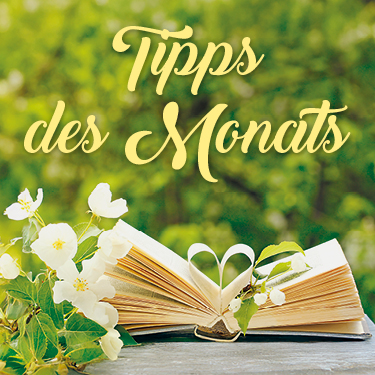 Ein aufgeschlagenes Buch mit Herzform in den Seiten, umgeben von Blumen und grünem Hintergrund. Text: Tipps des Monats