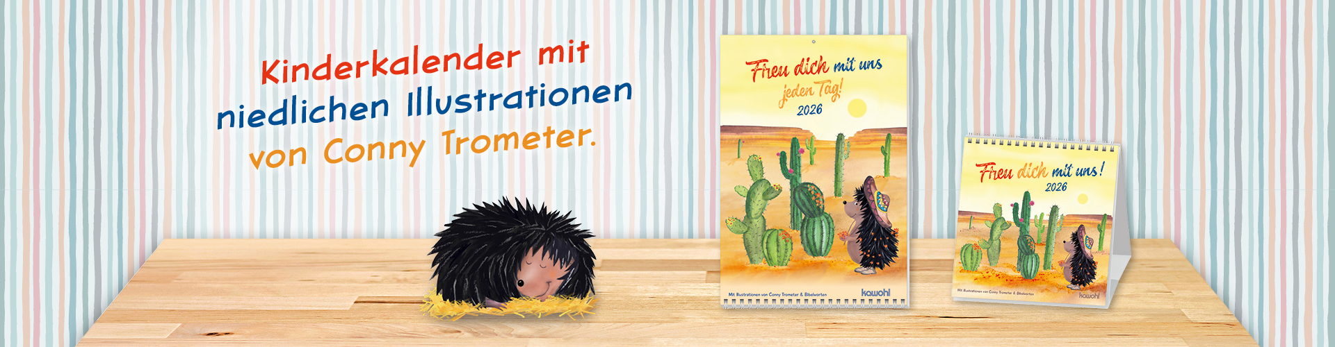 Kinderkalender mit niedlichen Illustrationen von Conny Trometer, präsentiert auf einem Holztisch vor einer gestreiften Wand.