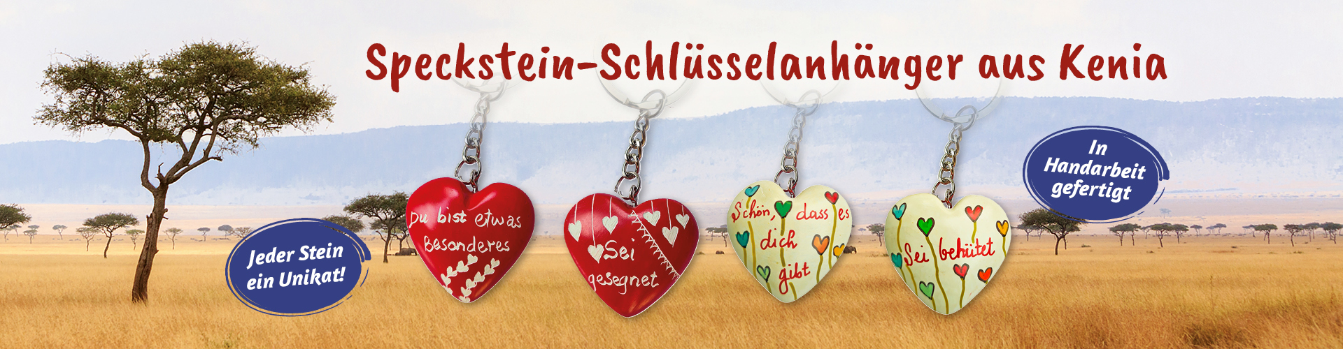 Speckstein-Schlüsselanhänger aus Kenia in Herzform mit Gravuren, darunter rote Herzen mit deutschen Sprüchen und zwei cremefarbende Herzen mit bunten Blumen vor Savannen-Hintergrund. Text: Jeder Stein ein Unikat!