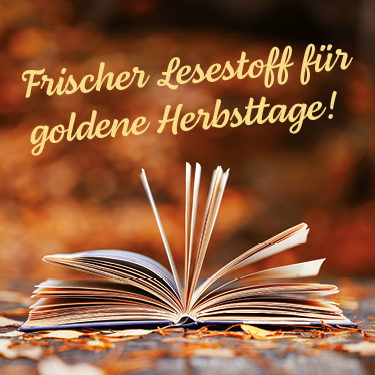 Offenes Buch mit aufgefächerten Seiten auf herbstlichem Hintergrund, goldener Text 
